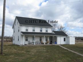Elizabethtown apartment for rent - A white house with a black roof and a sign that says HTC Real Estate.