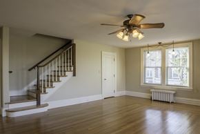Hershey apartment for rent - an empty living room with a staircase and a ceiling fan