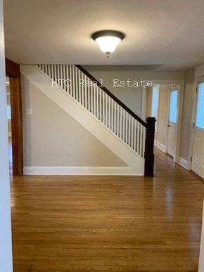 Elizabethtown apartment for rent - A wooden staircase with a black railing and a light on the ceiling.