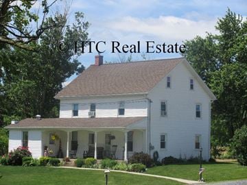 Elizabethtown apartment for rent - A white house with a porch and a mailbox in front.