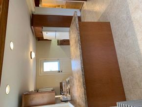 Elizabethtown apartment for rent - A room with a brown staircase and a small window.