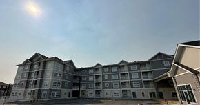Edmonton apartment for rent - an apartment building with the sun shining over it