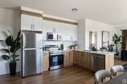 Edmonton apartment for rent - A modern kitchen with wooden cabinets and stainless steel appliances.at The Pointe at Riverview, Edmonton, AB T6M 3H4