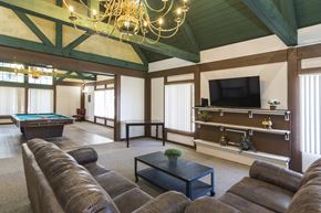 Colorado Springs apartment for rent - A large room with a pool table and a television.