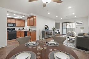 Anaheim apartment for rent - A modern dining room with a round table set for four.