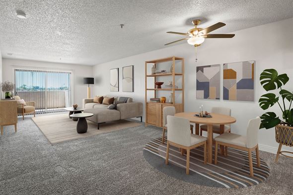 Anaheim apartment for rent - A living room with a grey carpet and a wooden dining table.