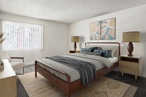 Santa Ana apartment for rent - A bedroom with a bed, nightstand, and chair.