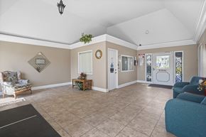 Anaheim apartment for rent - A living room with a sofa, armchair, and coffee table.