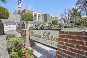 Anaheim apartment for rent - A brick wall with a sign that says Chateau Lore Lincoln.