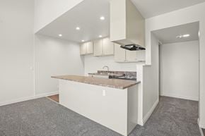 Anaheim apartment for rent - A kitchen area with a counter and cabinets.