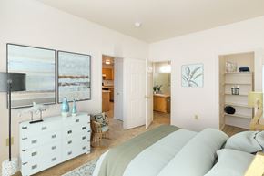 Colorado Springs apartment for rent - A bedroom with a large bed and a white dresser.