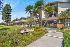 Anaheim apartment for rent - A sign that says Sierra West in front of a building.