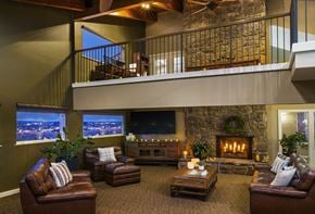 Colorado Springs apartment for rent - A cozy living room with a fireplace and comfortable seating.