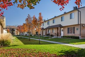 Taylorsville apartment for rent - A row of houses with trees in autumn colors in front.
