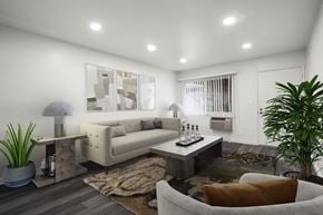Anaheim apartment for rent - A modern living room with a white sofa, a grey armchair, a coffee table, and a rug.