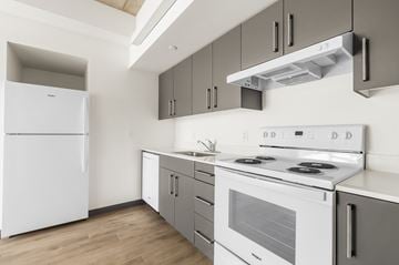 Portland apartment for rent - A white fridge and stove in a modern kitchen.