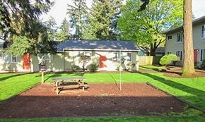 Portland apartment for rent - a picnic table in a yard in front of a house