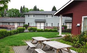 Portland apartment for rent - a group of picnic tables outside of a building