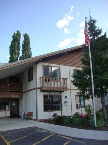 Leavenworth apartment for rent - a building with an flag in front of it