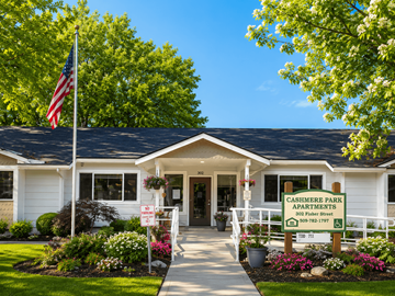 Cashmere apartment for rent - The front of Cashmere Park Apartments is shown with a clear blue sky in the background.