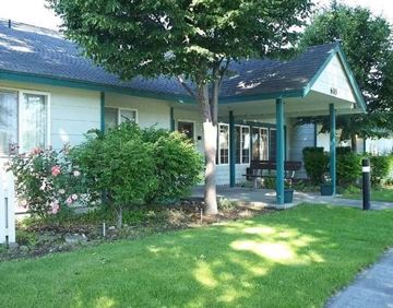 Moses Lake apartment for rent - a house with a porch and a tree in front of it