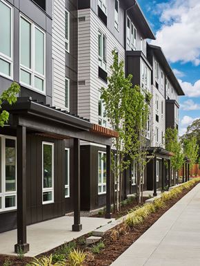 Portland apartment for rent - a sidewalk in front of a row of new apartment buildings