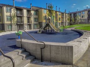 Happy Valley apartment for rent - A playground with a slide and a concrete structure in the foreground.