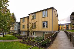 Happy Valley apartment for rent - A long building with a walkway in front.