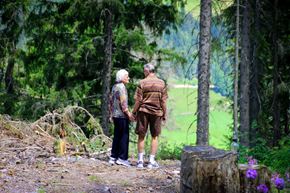 Vancouver apartment for rent - Two people are standing on a dirt path in the woods.