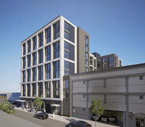 Portland apartment for rent - A modern building with a grey facade and large windows is depicted in the image.