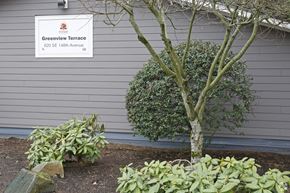 Portland apartment for rent - A sign for Greenview Terrace is mounted on a wall.