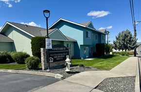 Grandview apartment for rent - A blue house with a sign that says Vineyard.