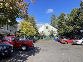 Portland apartment for rent - A red pickup truck is parked in a lot with other vehicles.