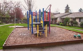 Portland apartment for rent - A playground with a red, yellow and blue slide.