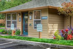 Clackamas apartment for rent - a small building with two signs in front of it