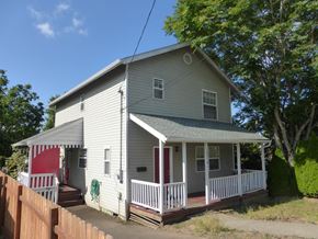 Portland apartment for rent - a house with a porch and a red door