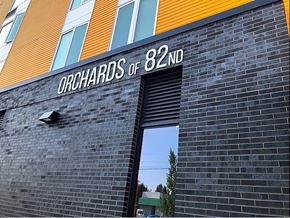 Portland apartment for rent - A building with a sign that says "Orchards of 82ND".