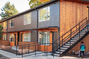 Portland apartment for rent - a modular home with a staircase and a porch in front of it