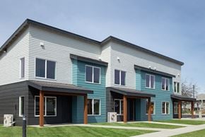 Ellensburg apartment for rent - a blue and gray house with a sidewalk and grass