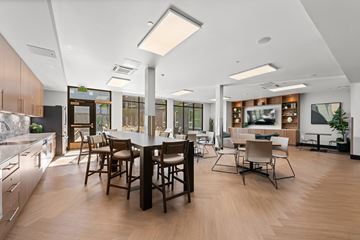 Portland apartment for rent - A modern kitchen with a dining table and chairs.