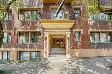Portland apartment for rent - A red brick building with a balcony and a staircase leading to the entrance.