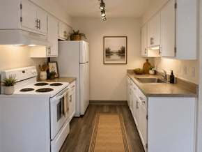 Clackamas apartment for rent - A kitchen with white appliances and cabinets.