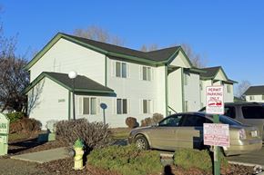 Sunnyside apartment for rent - a house with a car parked in front of it