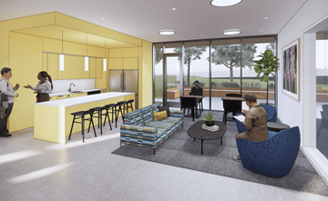 Portland apartment for rent - A modern kitchen with a yellow wall and people standing and sitting around it.