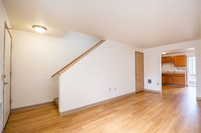 Vernonia apartment for rent - a living room with a white wall and wood floors