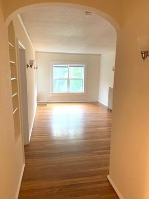 Portland apartment for rent - an empty room with wooden floors and a window