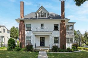 Princeton apartment for rent - A white house with a black roof and a chimney.