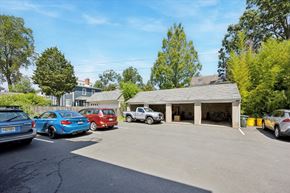 Princeton apartment for rent - A parking lot with cars and a building in the background.