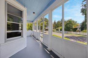 Princeton apartment for rent - A long white porch with a blue ceiling and white railings.