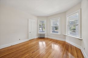 Princeton apartment for rent - A room with wooden floors and white walls.